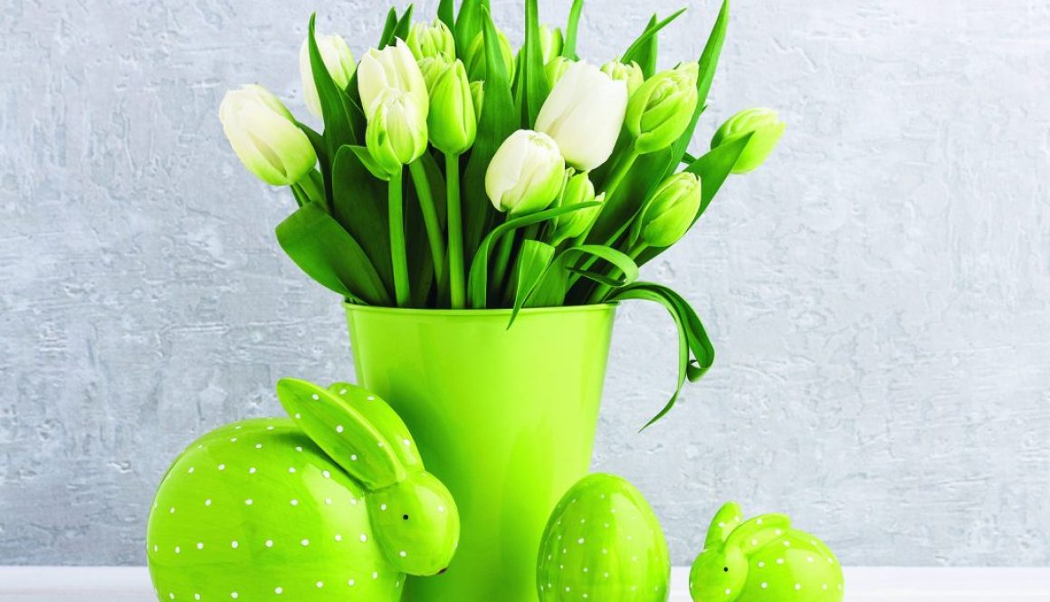 Bouquet of white tulips in green bucket and dotted ceramic rabbi