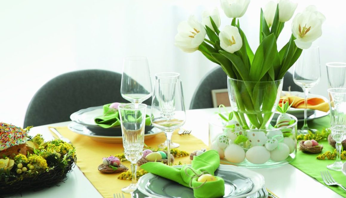 Festive Easter table setting with beautiful white tulips and egg