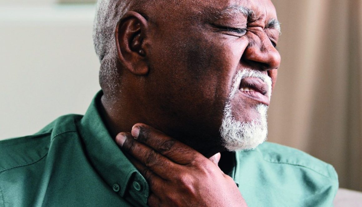 Sick African old man suffer from sore throat painful tonsillitis irritation senior male indoor check gland laryngitis bacterial infections diseases pain in neck severe ache cervical osteochondrosis