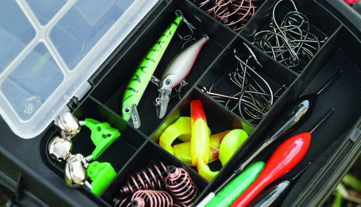 Various fisherman's equipment in a plastic tackle box